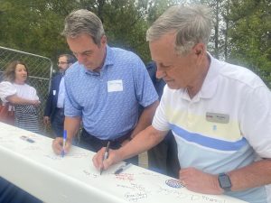 John Dawsey & Ken Riley signing the beam. June 2024