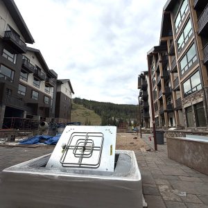 Firepit delivery for courtyard. horizontal. Aug. 2025